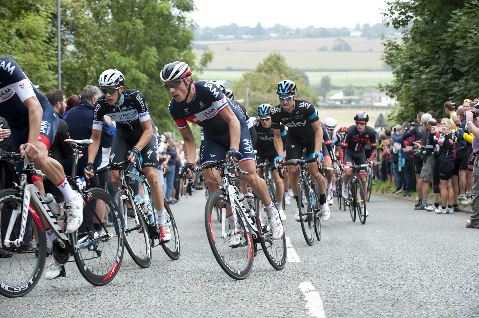 The team towing Sylvain Chavanel up, whilst Bernie Eisel grimaces behind.